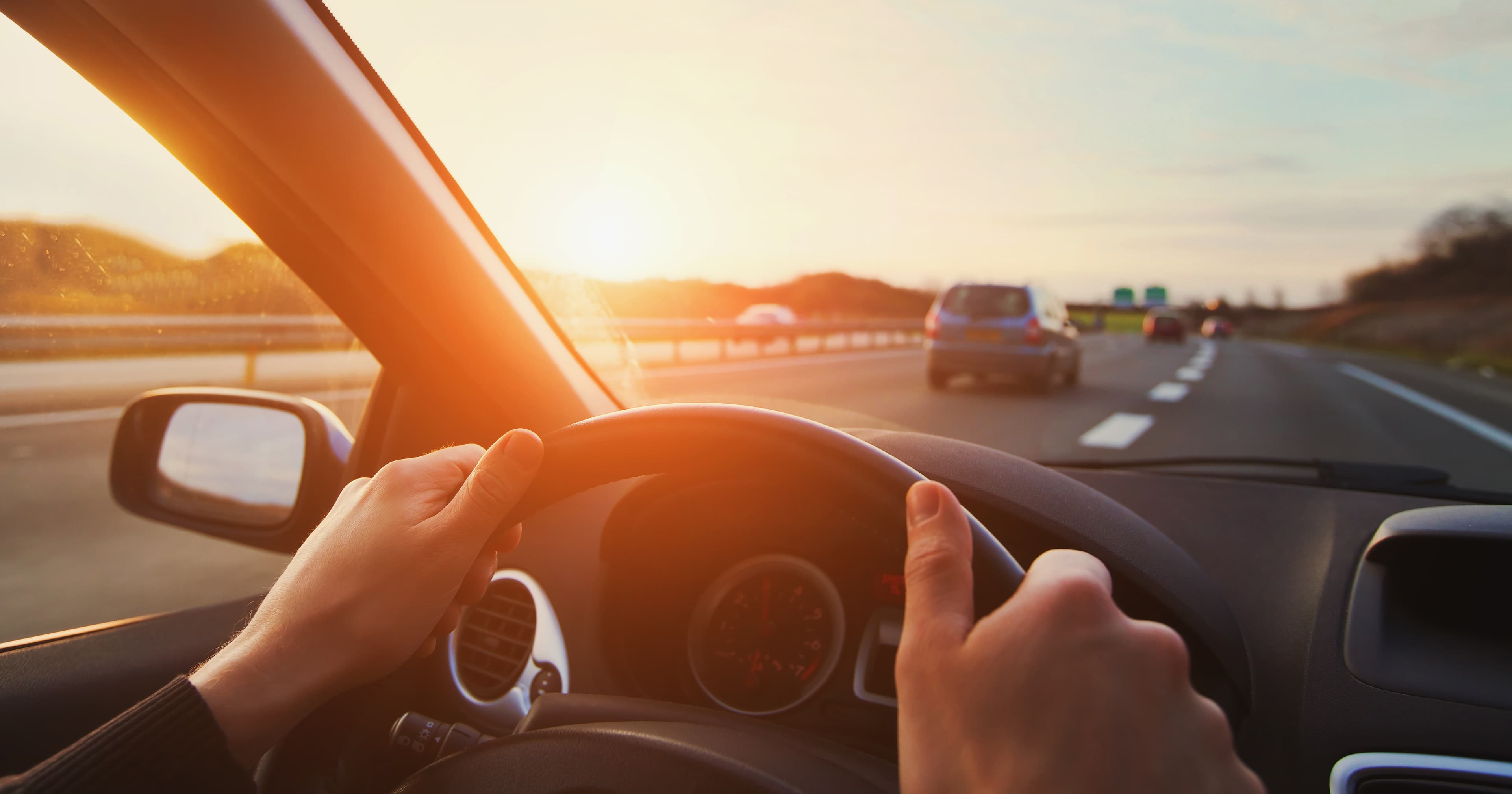 hands on steering wheel while driving