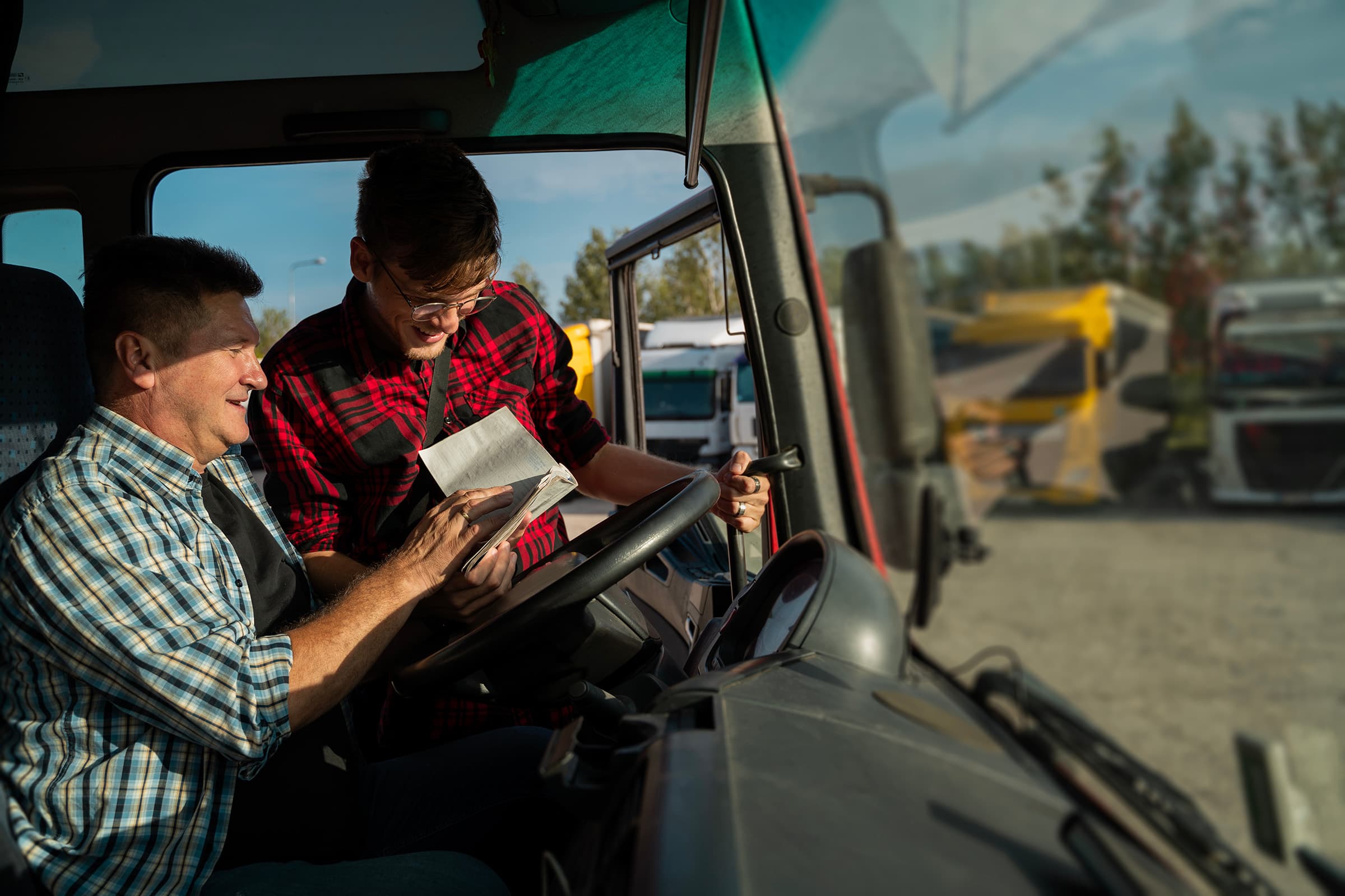 Fleet operators doing safety check of vehicle