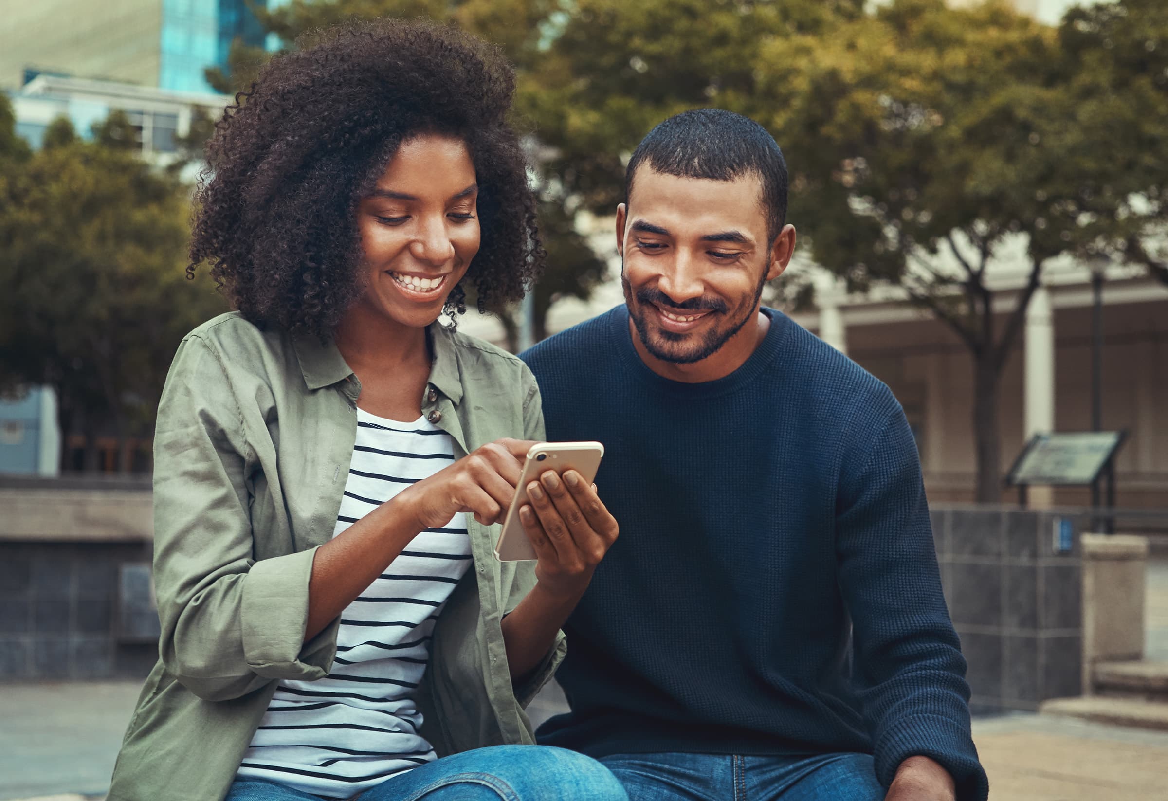 Parents smiling at phone